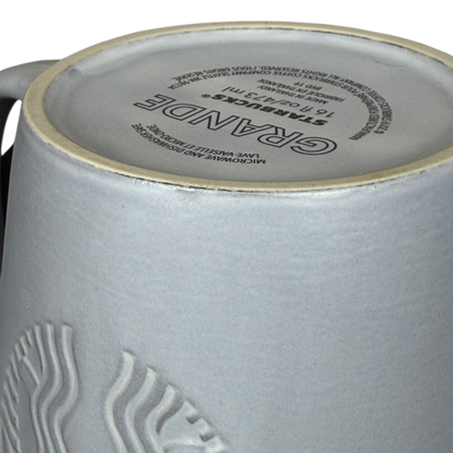 Close-up of the bottom of Grande Matte Gray Siren Collectible Mug Starbucks showcasing intricate design details