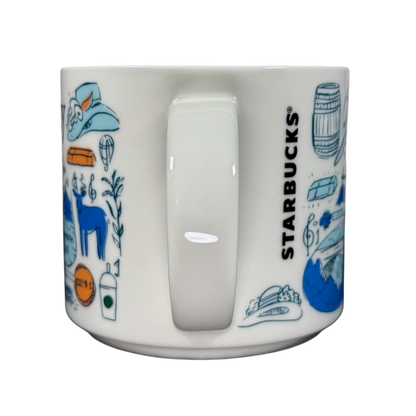 Kentucky Starbucks Been There mug with blue and orange Kentucky-themed illustrations and white handle