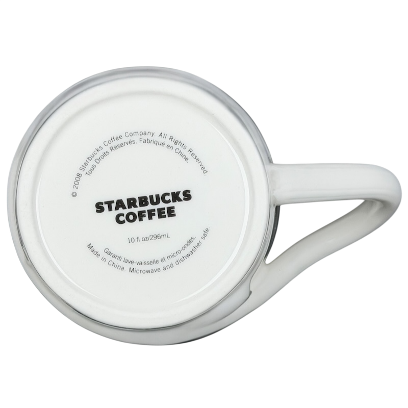 Bottom view of a white Starbucks leaf mug with logo and details for coffee enthusiasts