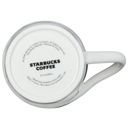 Bottom view of a white Starbucks leaf mug with logo and details for coffee enthusiasts