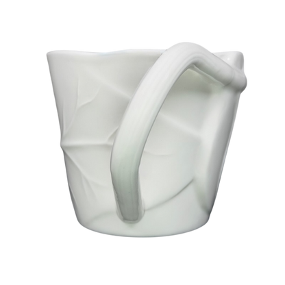 Starbucks leaf mug in white with a textured leaf design and a curved handle