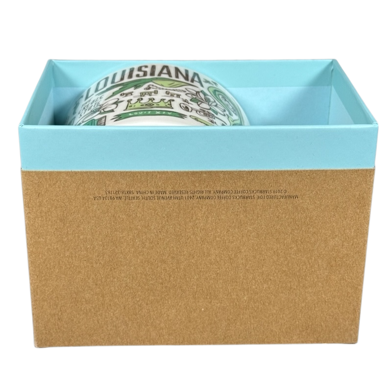 Starbucks Louisiana Been There mug partially visible in blue and brown gift box