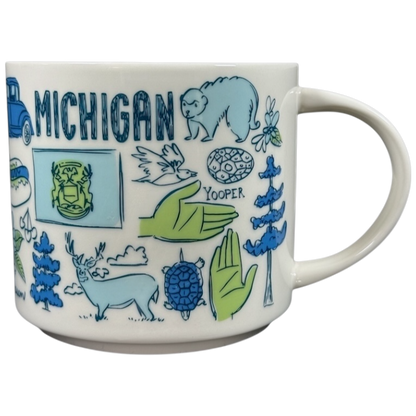 Starbucks Michigan Been There mug featuring blue and green illustrations of state symbols and wildlife