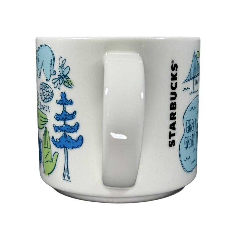 Starbucks Michigan Been There mug with blue and green state-themed illustrations on white ceramic