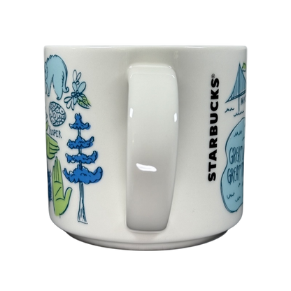 Starbucks Michigan Been There mug with blue and green state-themed illustrations on white ceramic