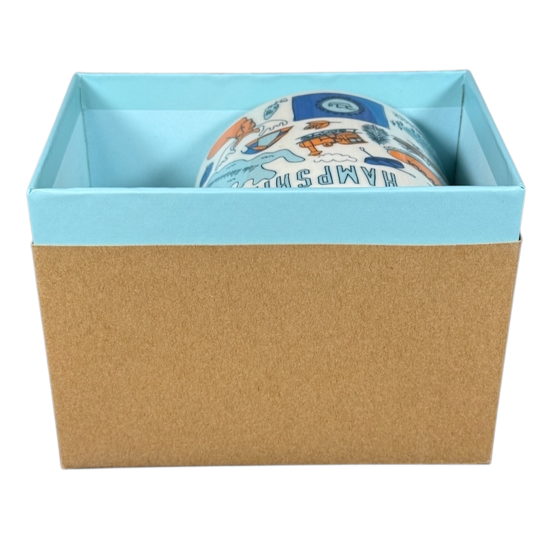 Starbucks New Hampshire Been There mug partially visible inside a blue and brown gift box