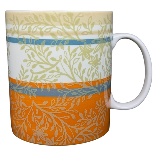 Starbucks orange Zen Leaves vintage mug featuring floral patterns in muted colors