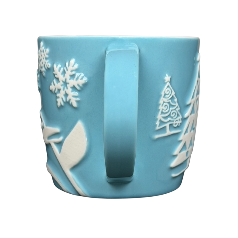 Starbucks penguin snowman skiing vintage mug in light blue with embossed winter designs
