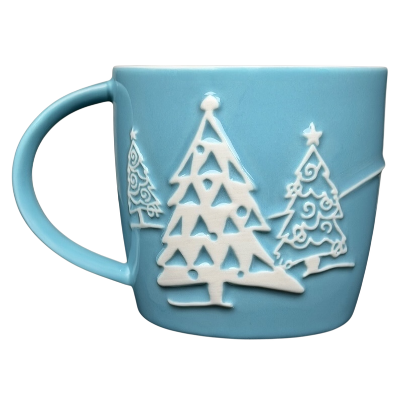 Starbucks penguin snowman skiing vintage mug featuring embossed holiday tree designs in blue