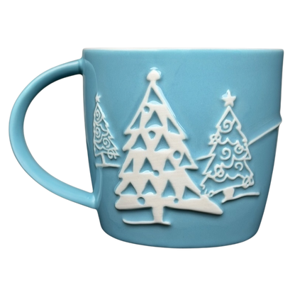 Starbucks penguin snowman skiing vintage mug featuring embossed holiday tree designs in blue
