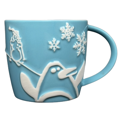 Starbucks penguin snowman skiing vintage mug in light blue with embossed design and snowflakes