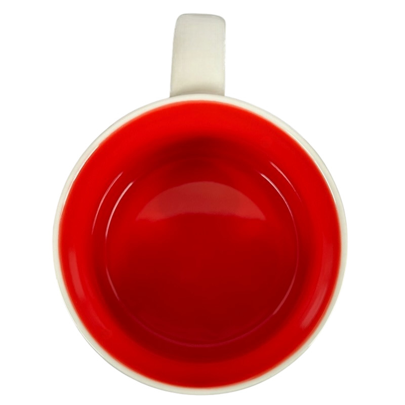 Top view of Starbucks Phoenix Been There mug with bright red interior and white handle on black background