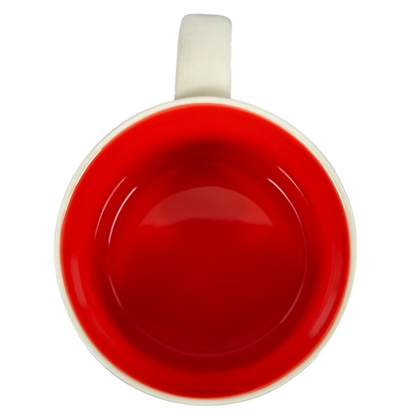 Top view of Starbucks Phoenix Been There mug with bright red interior and white handle on black background