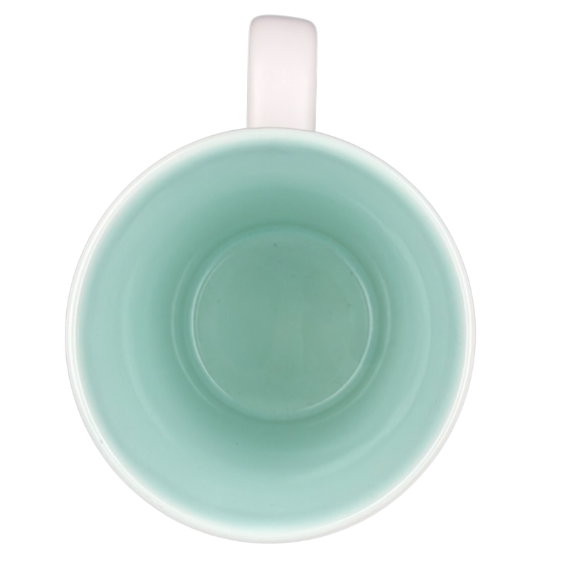 Inside view of a rare Starbucks XOXO mug featuring a mint green finish and a white handle