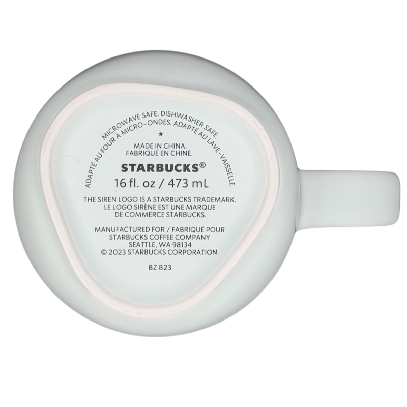 Bottom view of 16 oz recycled ceramic Starbucks mug labeled for microwave and dishwasher safety