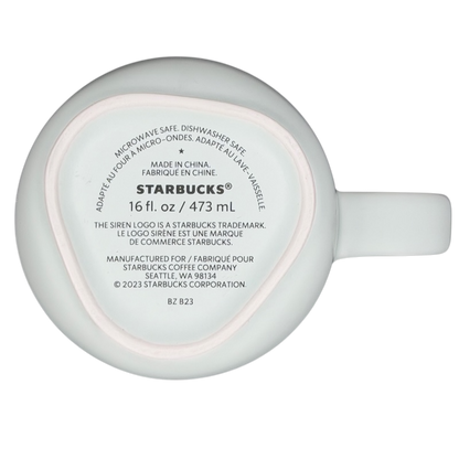 Bottom view of 16 oz recycled ceramic Starbucks mug labeled for microwave and dishwasher safety