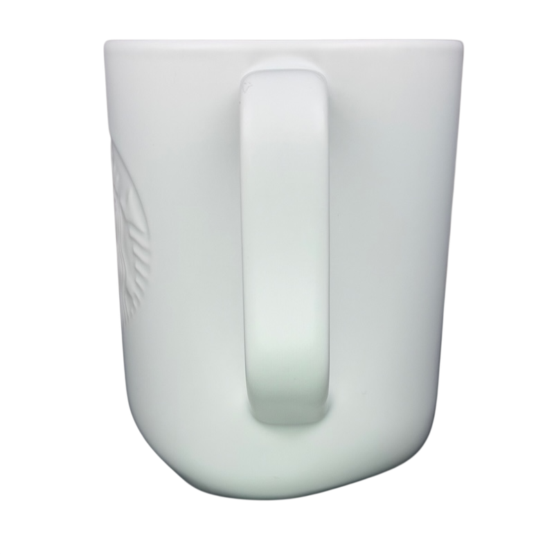 Side view of a recycled ceramic Starbucks mug showcasing a sleek design and comfortable handle