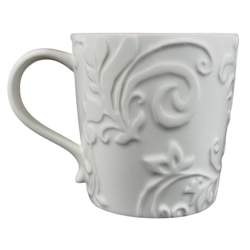 Elegant white Reindeer Mug Starbucks with embossed floral design for hot beverages