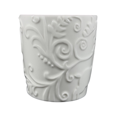Elegant white Reindeer Mug Starbucks with intricate embossed design suitable for holiday beverages