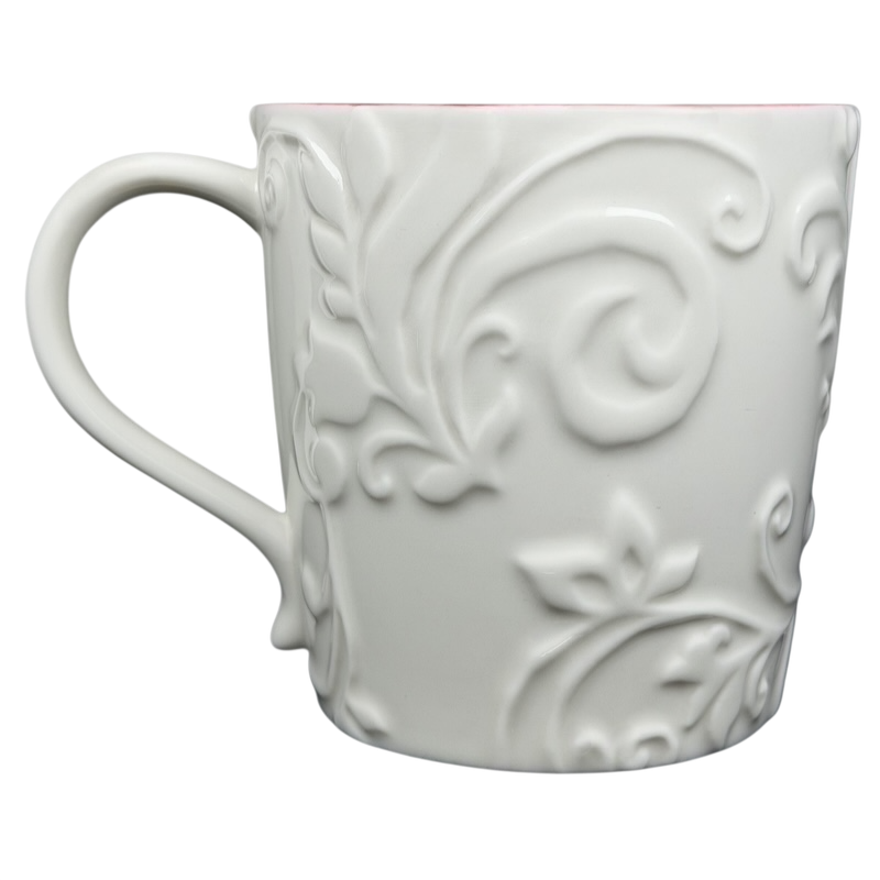 Elegant white Reindeer Mug Starbucks with embossed floral design and a comfortable handle