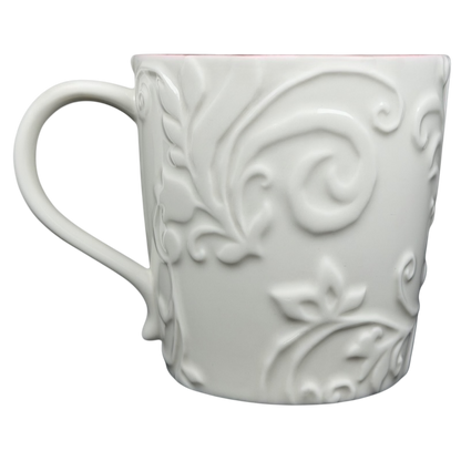 Elegant white Reindeer Mug Starbucks with embossed floral design and a comfortable handle