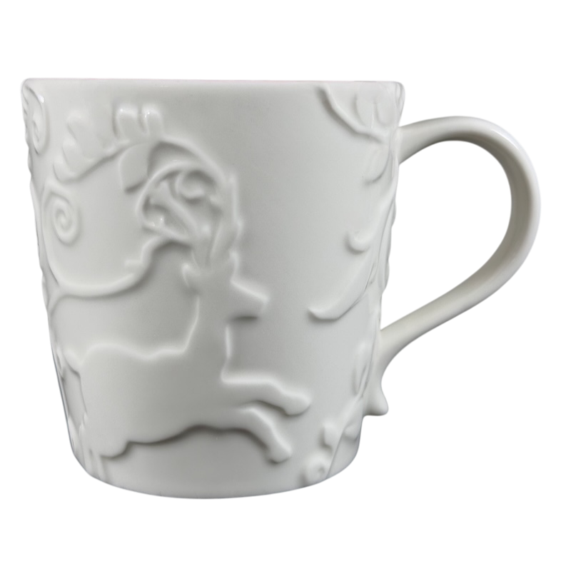 White Reindeer Mug Starbucks featuring intricate embossed reindeer design for holiday enjoyment