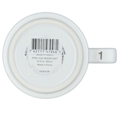 Bottom view of a white Starbucks Reserve Roastery NYC mug with a barcode and size indication