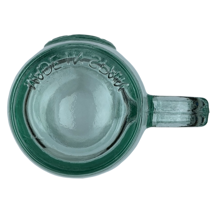 Top view of Starbucks San Miguel recycled green glass mug with a clear handle and textured surface