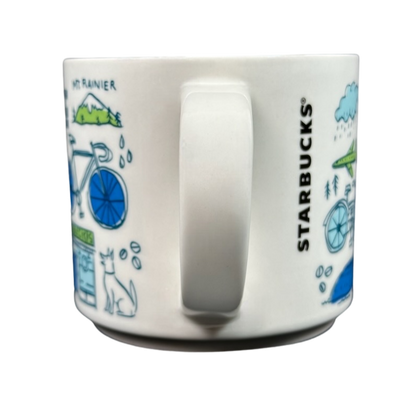 White ceramic Seattle Starbucks Been There mug featuring blue bike and local Seattle illustrations