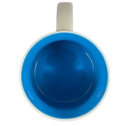 Top view of Seattle Starbucks Been There mug with bright blue interior and white handle