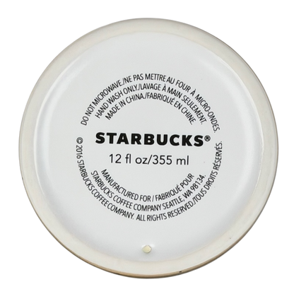 Bottom view of Starbucks Siren Tattoo collectible Tumbler with care instructions and capacity details