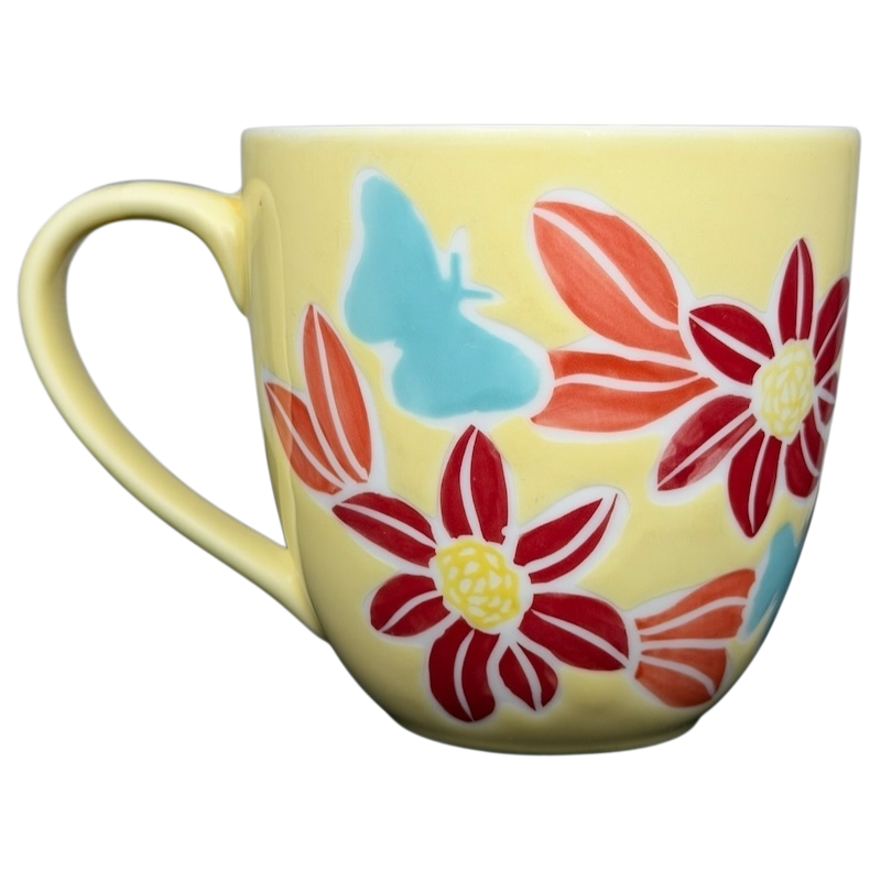 Starbucks spring butterfly vintage mug featuring vibrant flowers and a butterfly design