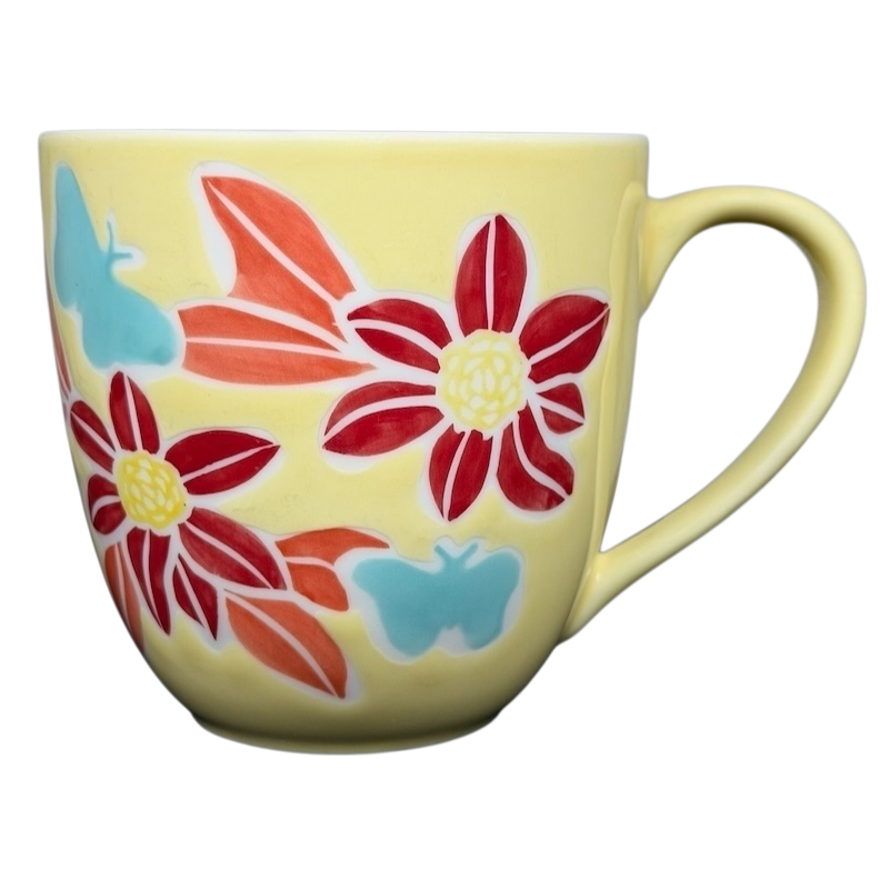 Starbucks spring butterfly vintage mug featuring colorful floral and butterfly designs on a yellow background