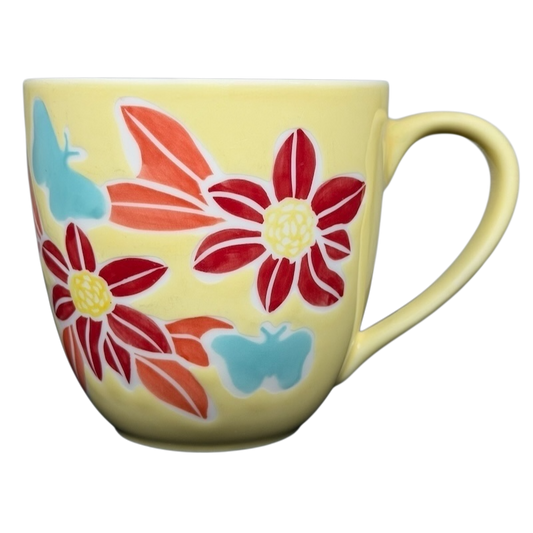 Starbucks spring butterfly vintage mug featuring colorful floral and butterfly designs on a yellow background
