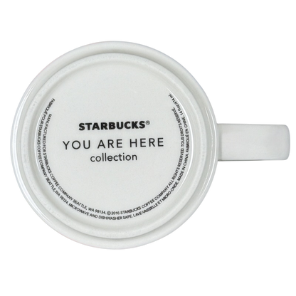 Top view of white Starbucks New Jersey You Are Here collectible mug. Shows bottom logo and handle on black background