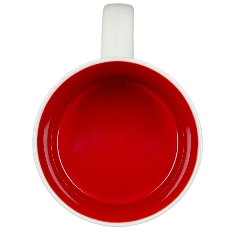 Overhead view of Starbucks New Jersey You Are Here collectible mug with glossy red interior and white handle on black background
