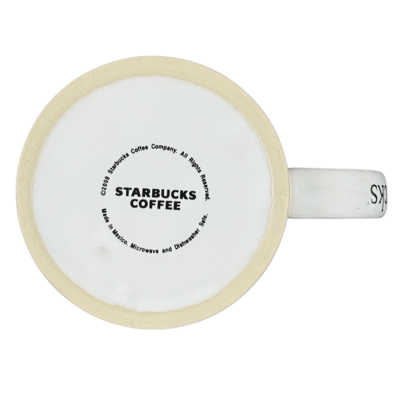 Bottom view of a white ceramic Starbucks Puerto Vallarta vintage mug showing Starbucks Coffee stamp Made in Mexico and beige rim