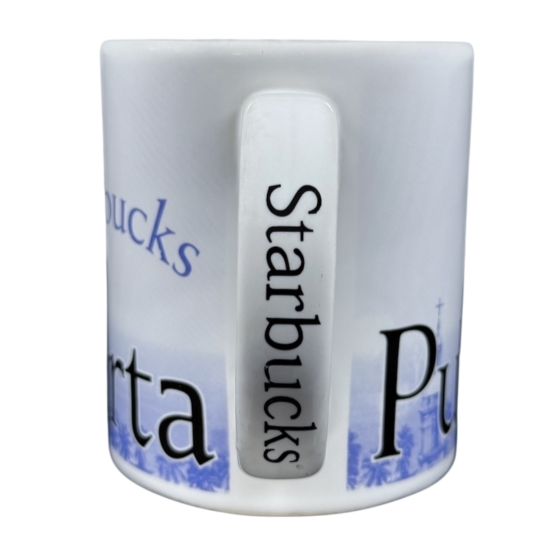 White Starbucks Puerto Vallarta vintage mug showing handle with vertical Starbucks logo and blue coastal design