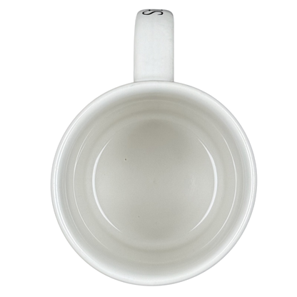 Top view of empty white ceramic Starbucks Puerto Vallarta vintage mug with handle on black background