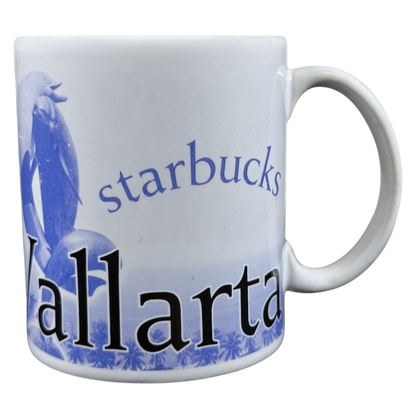 White ceramic Starbucks Puerto Vallarta vintage mug with blue Vallarta text and dolphin artwork