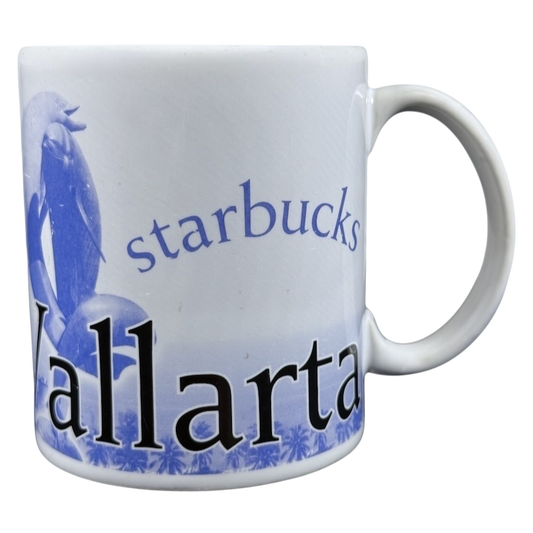 White ceramic Starbucks Puerto Vallarta vintage mug with blue Vallarta text and dolphin artwork