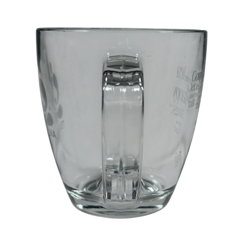 Clear Teavana glass mug with handle on black background Starbucks Teavana Come Let Us Have Some Tea glass mug.