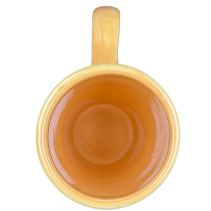 Top view of the Summer Daisy Latte Mug Starbucks with a vibrant yellow exterior and terracotta interior