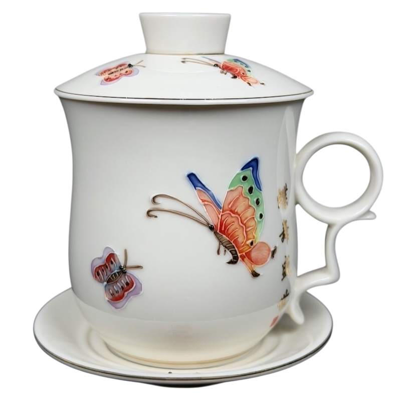 Enchanted Butterfly Mug Starbucks Teavana with colorful butterfly designs and a matching saucer
