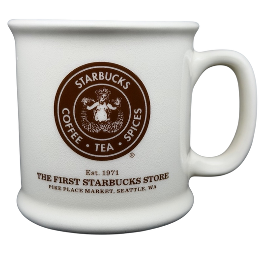Ceramic white mug featuring The First Starbucks Store Pike Place Market Seattle WA logo with handle