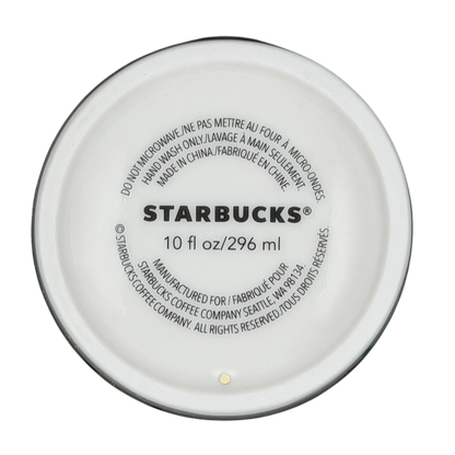 Bottom view of Starbucks Valentine's Day embossed heart tumbler with care instructions and capacity details