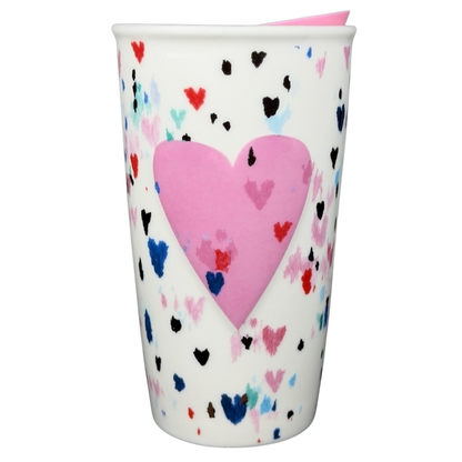 Starbucks Valentine's Day embossed heart tumbler with colorful heart designs and a pink heart centerpiece