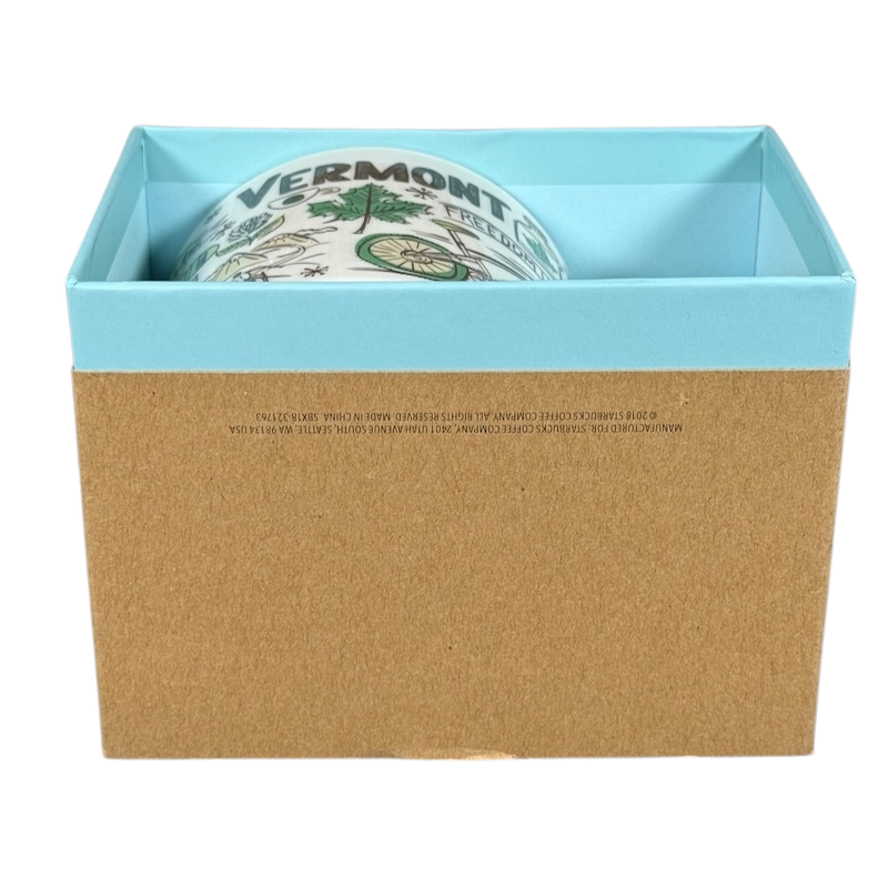 Starbucks Vermont mug Been There Series partially visible inside blue and brown display box