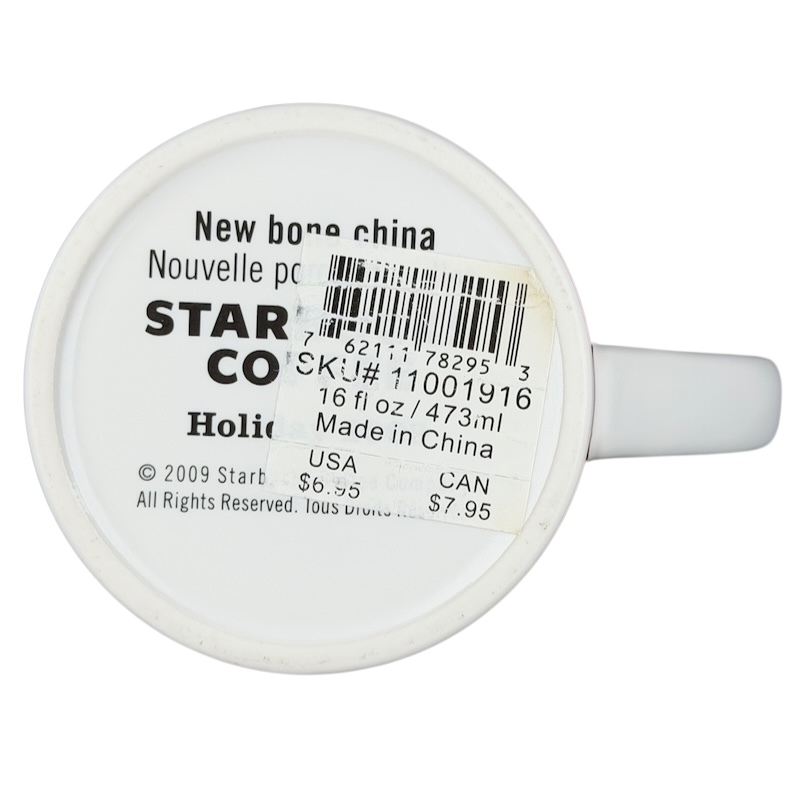 Vintage 2009 Starbucks holiday mug with a white exterior and 16 oz capacity, made in China