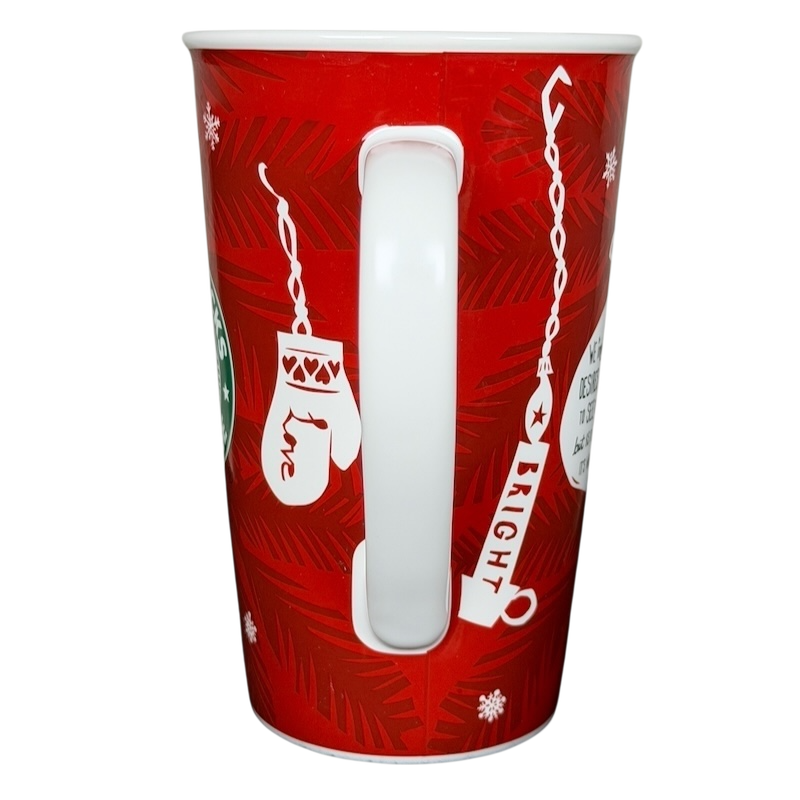 Vintage 2009 Starbucks holiday mug in red with festive designs and a white handle